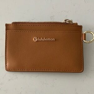 Lululemon leather alternative card case in chestnut brown and gold